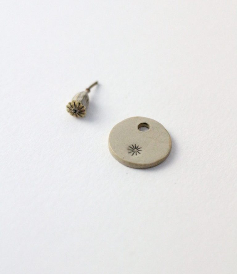 poppy capsule and earring hanger with poppy print